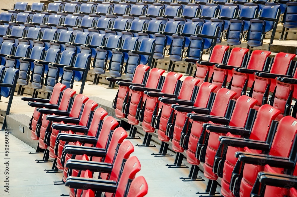 Fototapeta premium Conference room full of blue and red seats