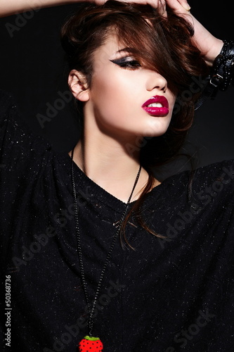 glamor sexy stylish model in black cloth with bright makeup