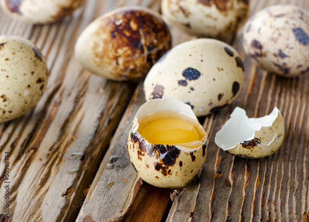 Quail eggs on wooden table Quail eggs on wooden table