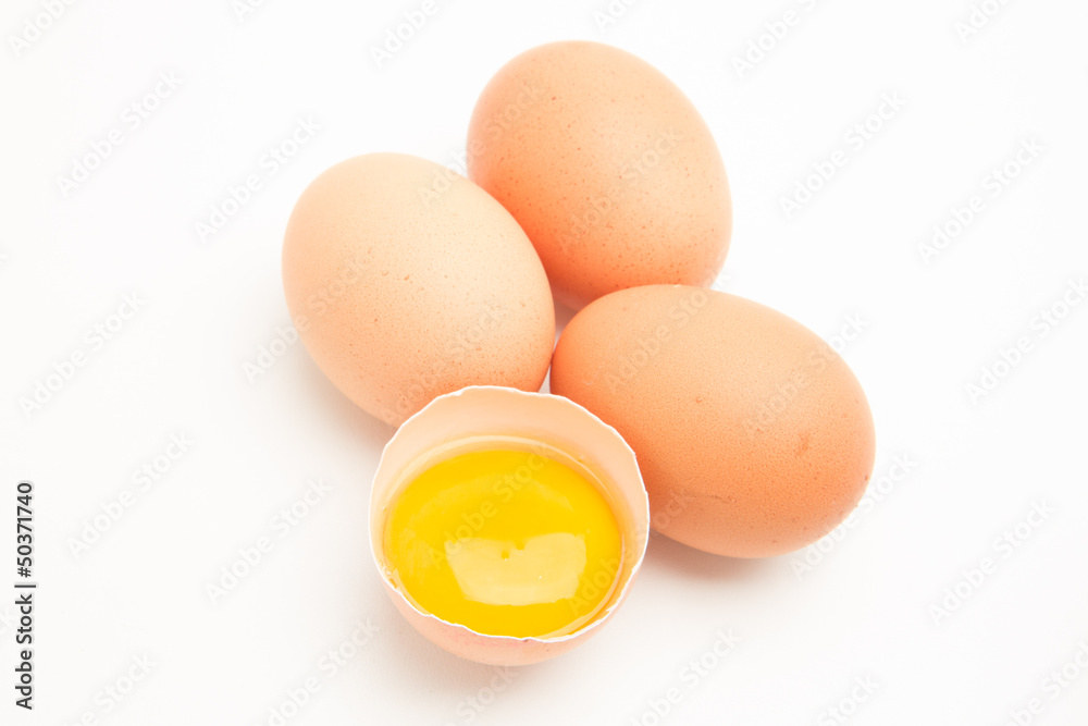 Three eggs with a yolk in half a shell Three eggs with a yolk in half a shell