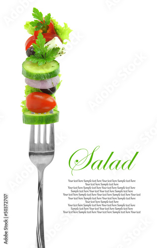 Fresh mixed vegetables on fork