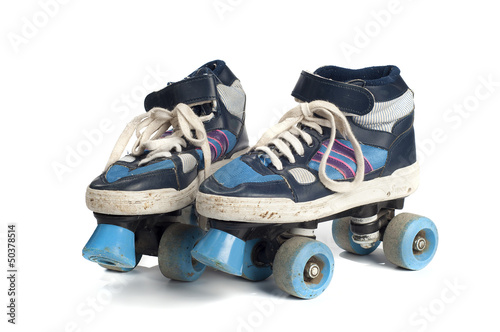 Quadro su tela old blue rollerblades isolated on white background