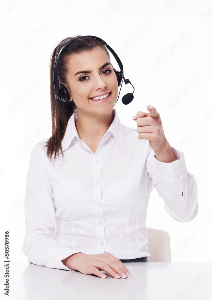 Woman with headset pointing at you Woman with headset pointing at you