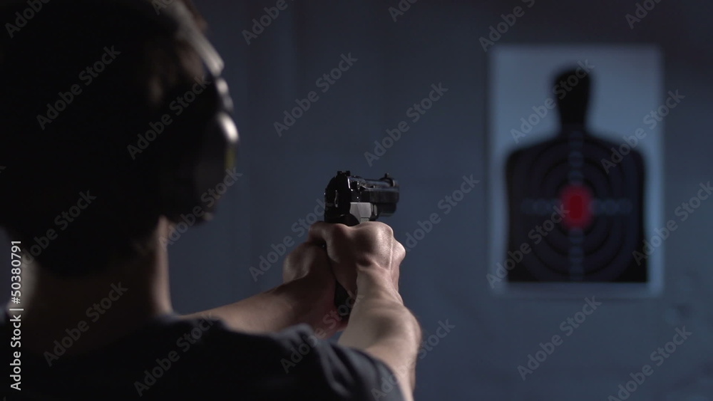 Over the shoulder of shooter, practicing on a target