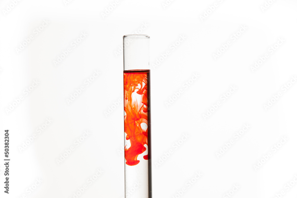 Test tube of water with orange paint Test tube of water with orange paint