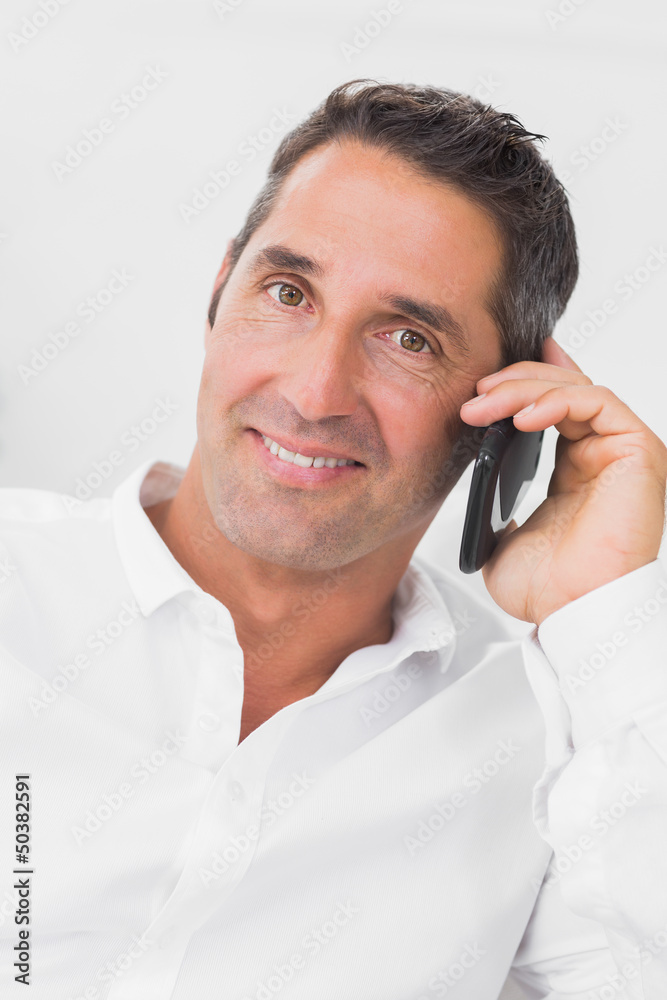 Man looking happy and talking on the phone Man looking happy and talking on the phone