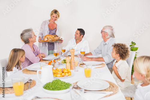Family watching the roast turkey