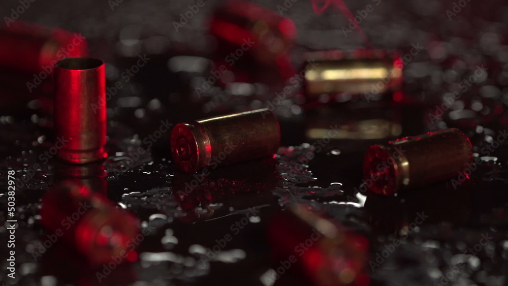 9 mm bullet casings on the ground with flashing lights