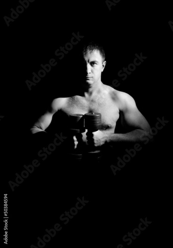 Fotografie Beefy guy with a dumbbell