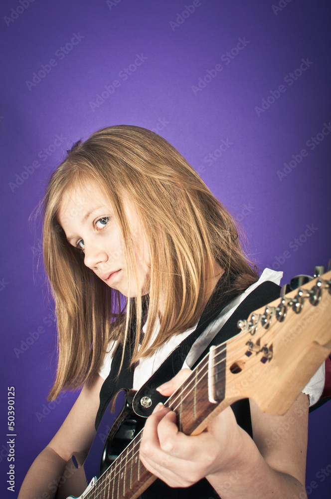 Girl learning the guitar