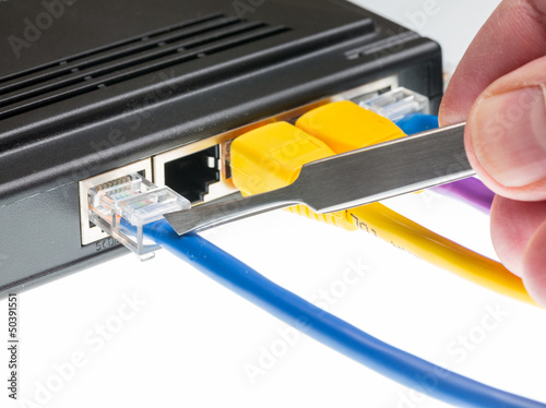 Cat5 cables and router for cyberdefence concept photo