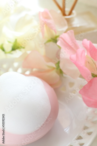 Pink facial soap and flower for beauty image
