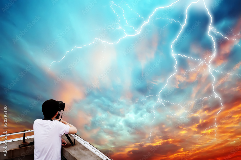 Photographer shooting lightning Photographer shooting lightning