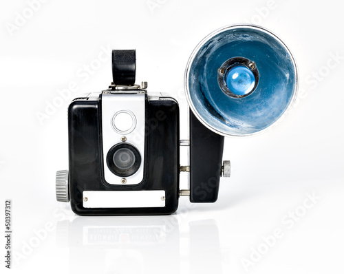 vintage camera with flash on white background.