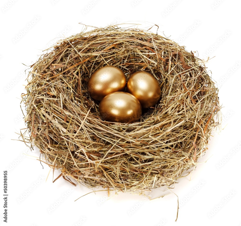 Three golden eggs in hay nest Three golden eggs in hay nest
