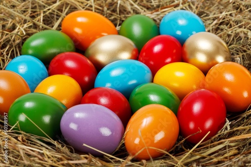 Close view of colorful Easter eggs in nest