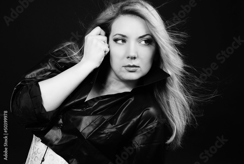 Beautiful girl blonde in white êàðñåòå and black shirt