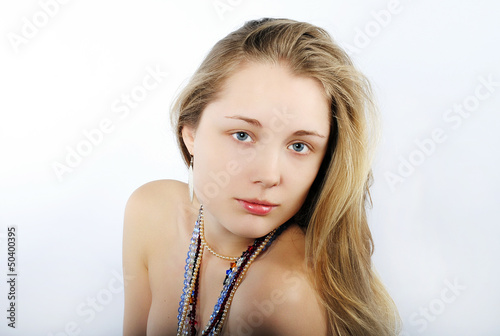 Portrait of the beautiful girl in costume jewellery