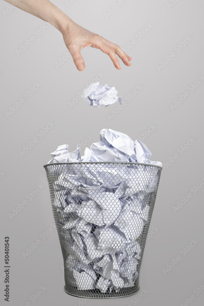 The hand of woman throwing crumpled paper into trash bin Stock Photo |  Adobe Stock