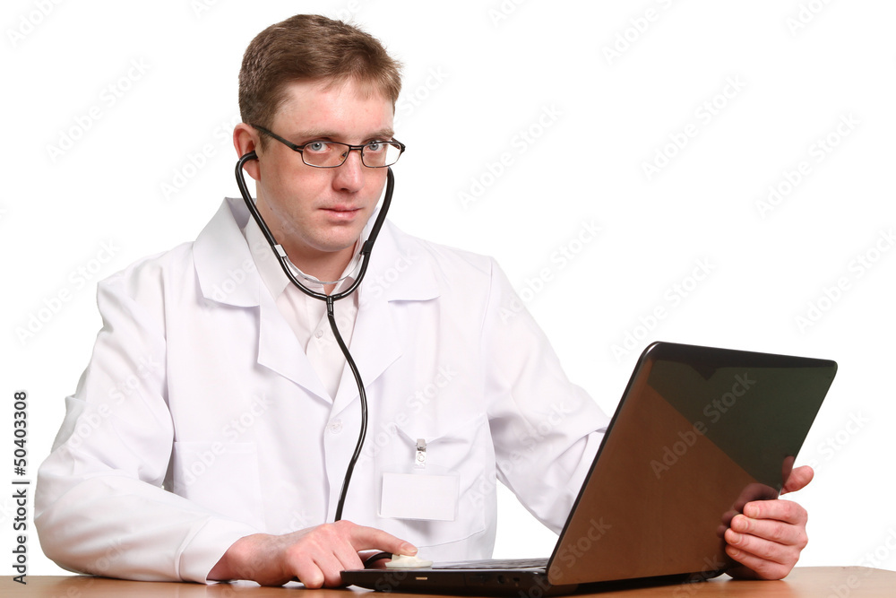 Smiling doctor with stethoscope working on a laptop Smiling doctor with stethoscope working on a laptop