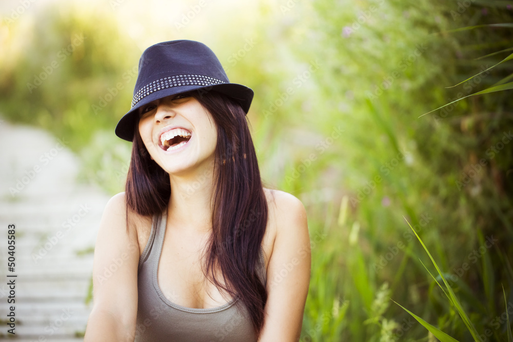 Cheerful woman with hat