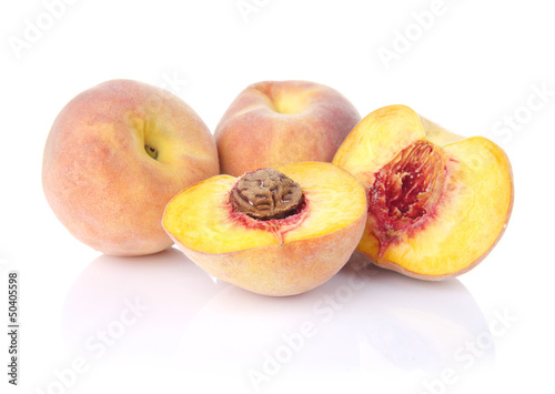 Fresh peaches isolated on white background