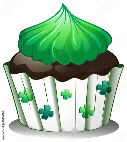 A chocolate cupcake with green toppings