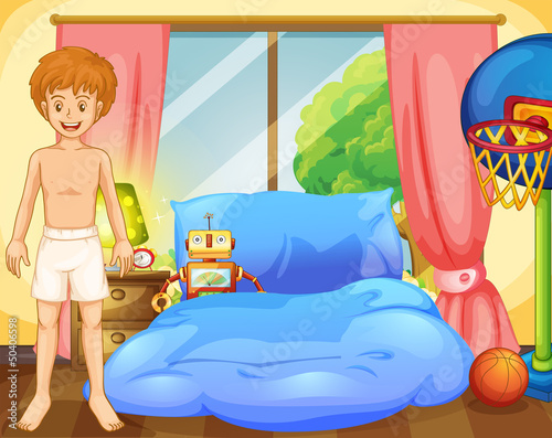 A boy inside his room with a robot and a basketball net