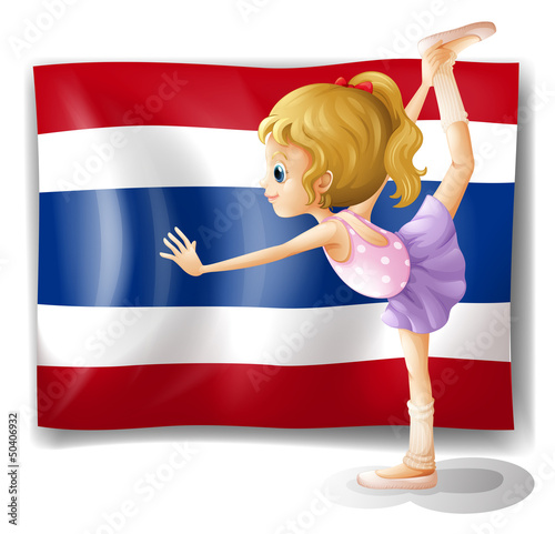 A ballet dancer in front of the Thailand flag