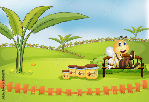 A bee sitting at the bench with jars of honey