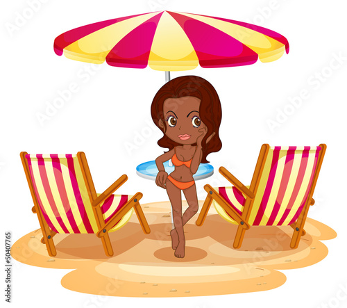 A tan lady at the beach near the beach umbrella and chairs