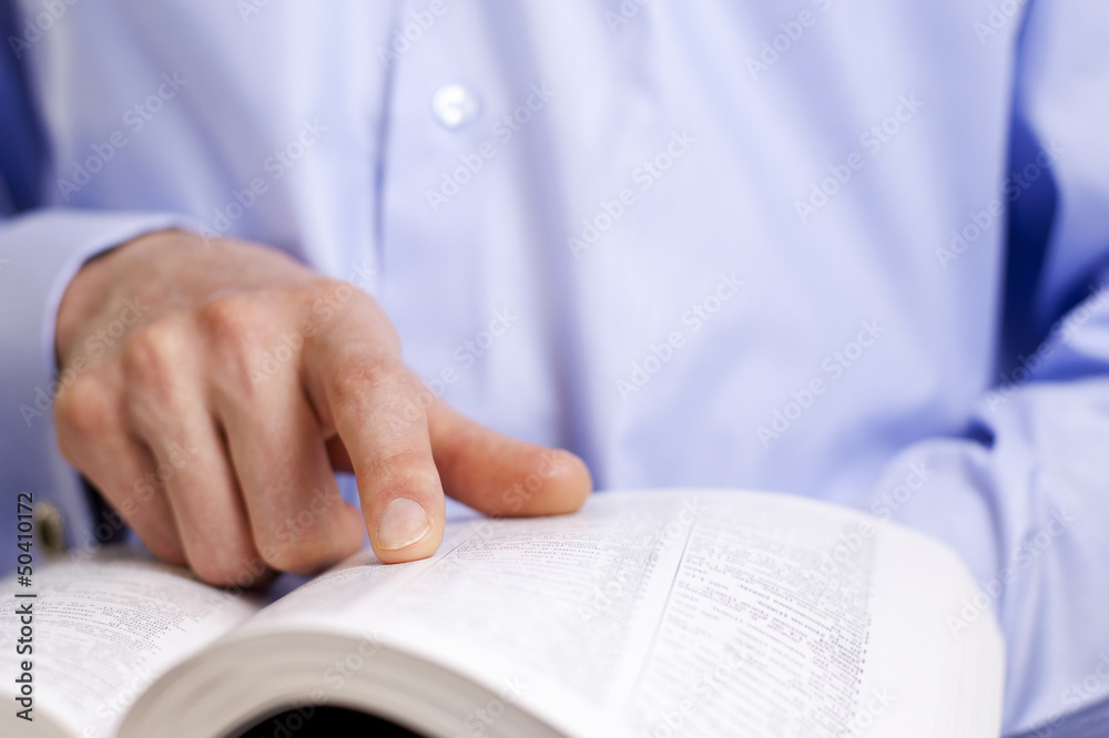 hand and a book hand and a book