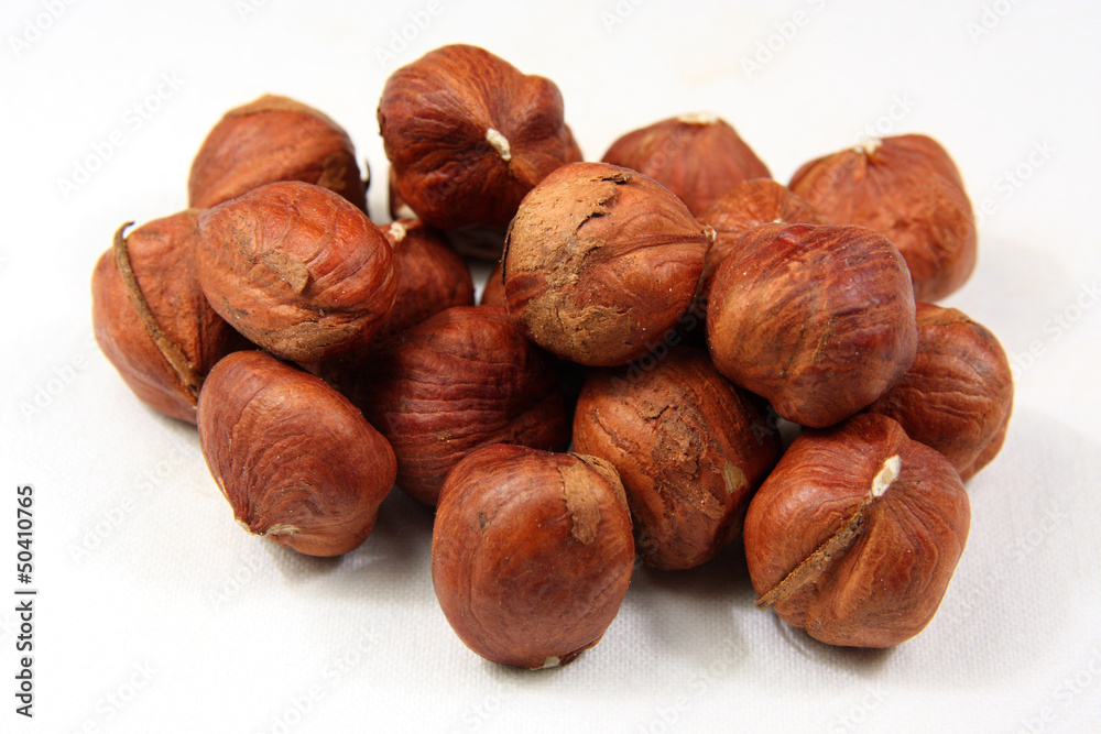 Hazelnuts heap against white background