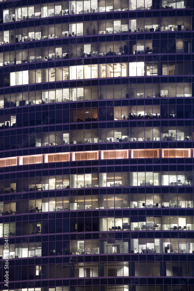 The light in the windows of the building at night The light in the windows of the building at night