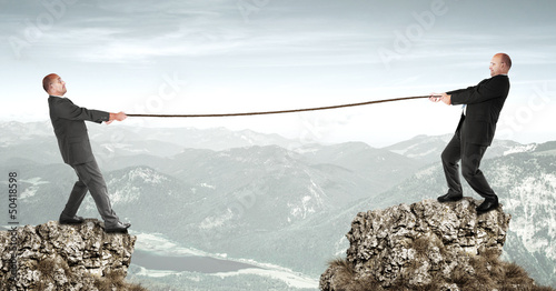 Two businessmen doing tug of war