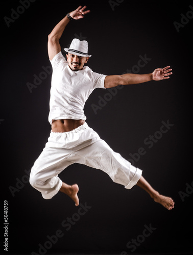 Dancer dancing dances in white clothing