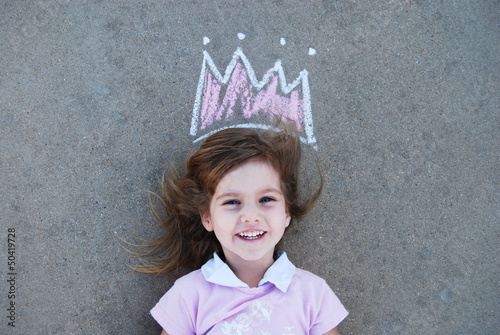 Young girl with chalk drawn crown