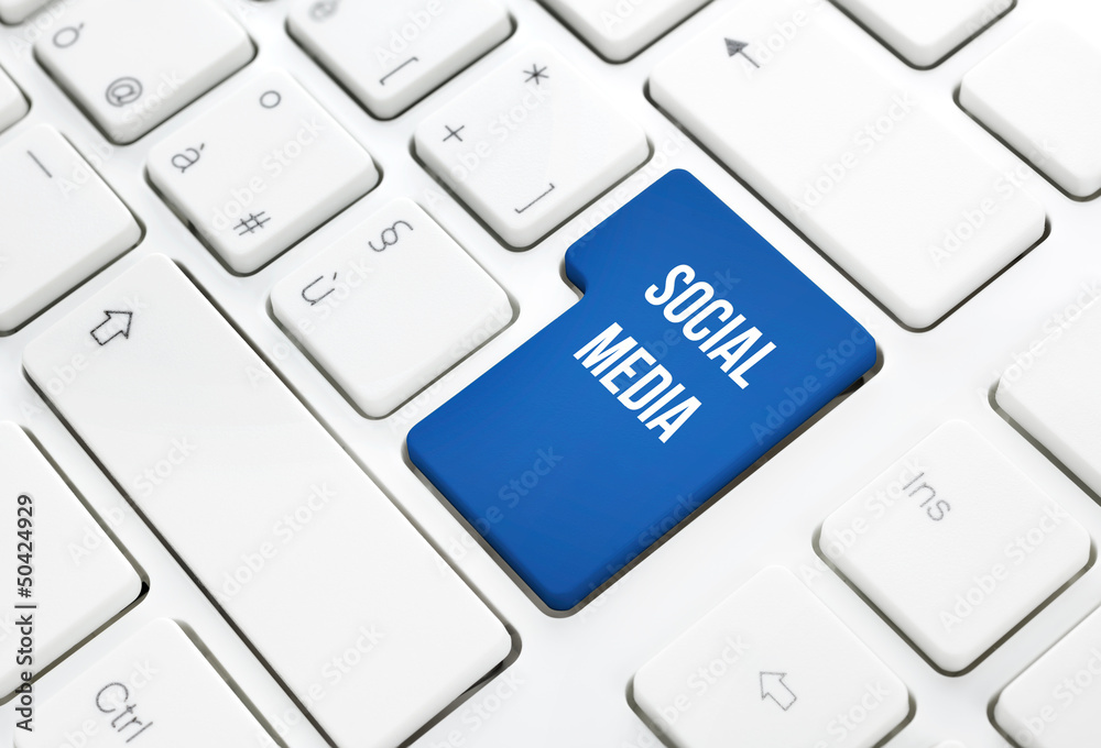 Social Media business concept button or key on white keyboard Social Media business concept button or key on white keyboard