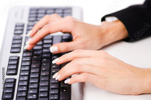 Hands working on the keyboard