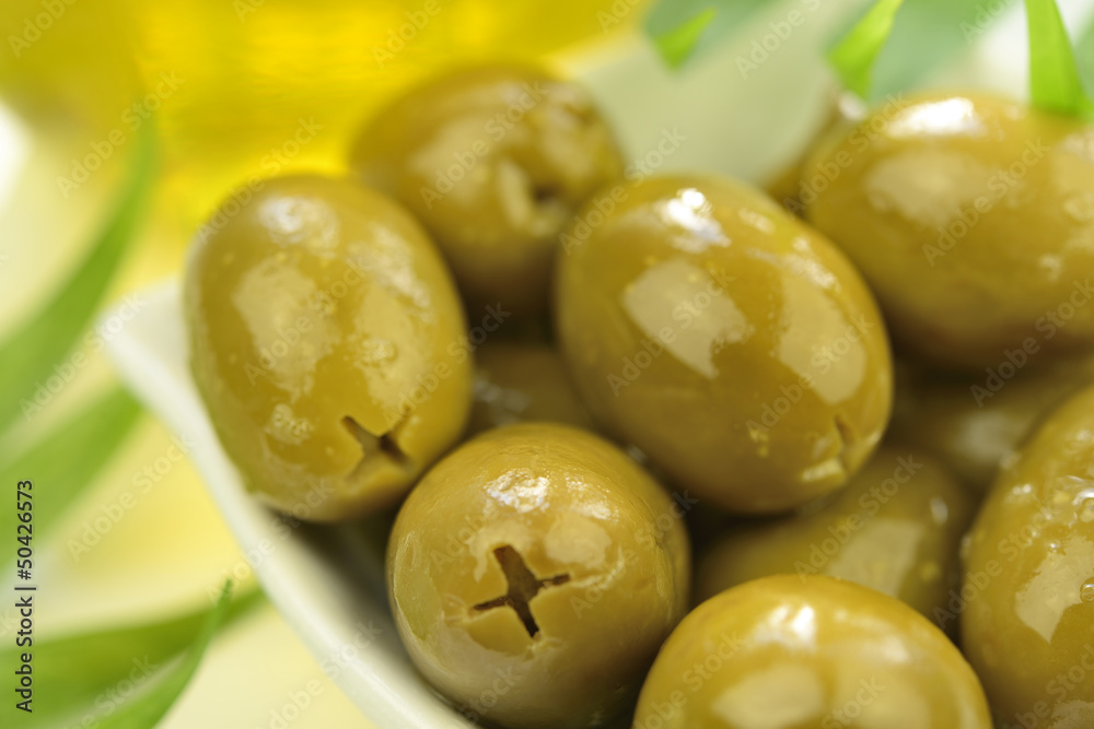 Stuffed green olives and olive oil macro Stuffed green olives and olive oil macro