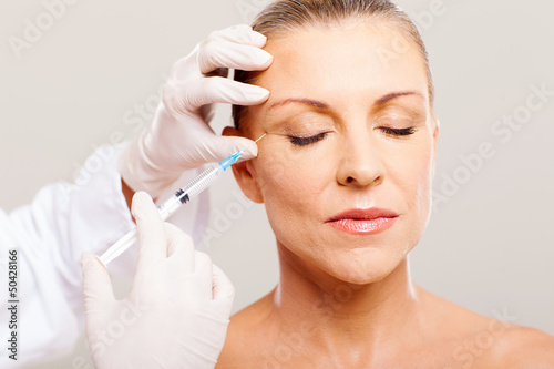 beautician giving face lifting injection