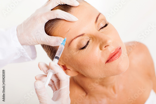 doctor giving face lifting injection