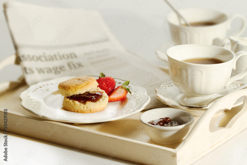 Scone with strawberry jam and clotted cream , afternoon tea brea Scone with strawberry jam and clotted cream , afternoon tea brea