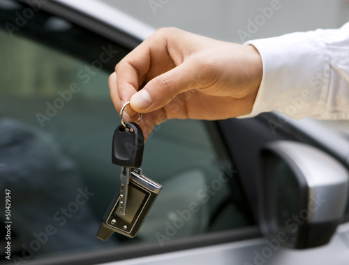 Man handing a car keys