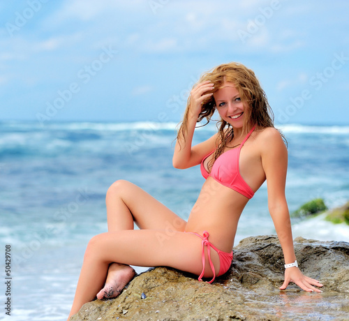 Young girl on the ocean coast