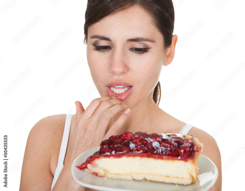 Young Woman Tasting Cake