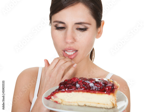 Young Woman Tasting Cake