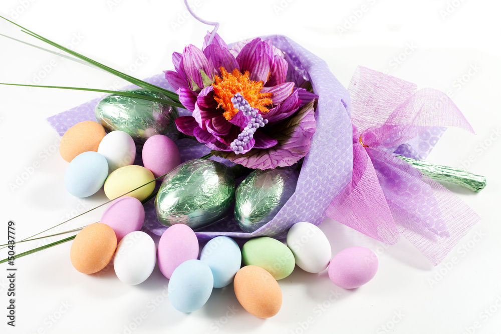 Colorful Easter Eggs with flowers and chocolate eggs Colorful Easter Eggs with flowers and chocolate eggs