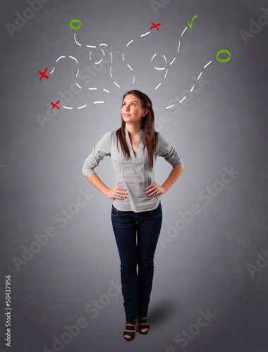 Young woman thinking with abstract marks overhead