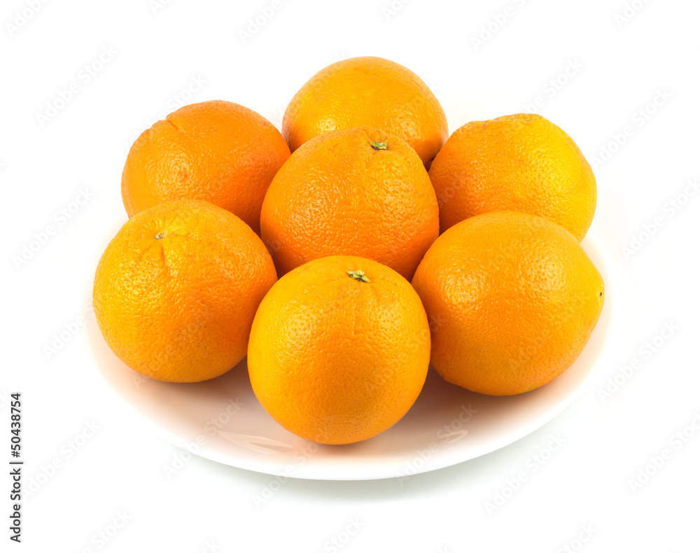 Many oranges on plate isolated over white Many oranges on plate isolated over white